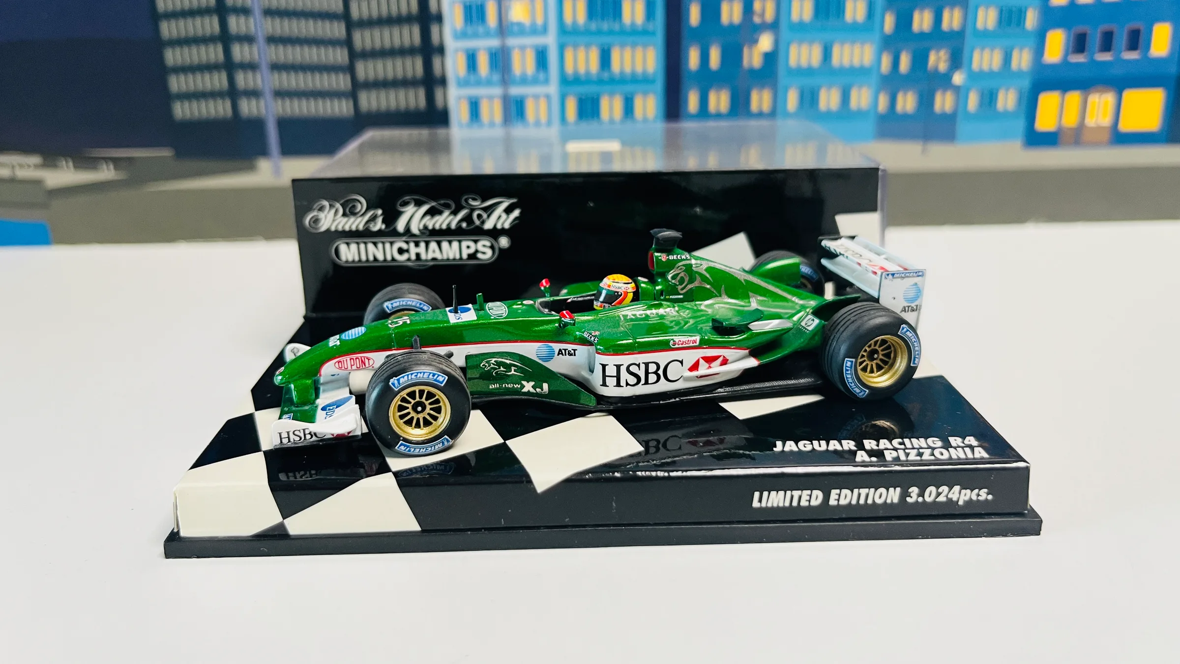 Minichamps 1:43 Jaguar Racing R4, A. Pizzonia — three-quarter view on its plinth